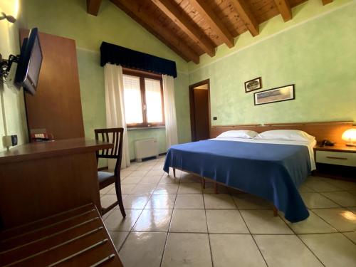 Ein Bett oder Betten in einem Zimmer der Unterkunft Sole della Franciacorta - Hotel & Restaurant