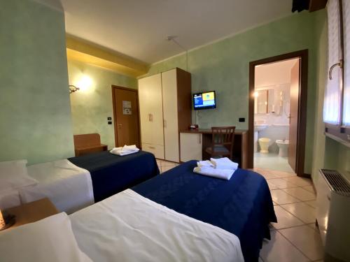 Ein Bett oder Betten in einem Zimmer der Unterkunft Sole della Franciacorta - Hotel & Restaurant