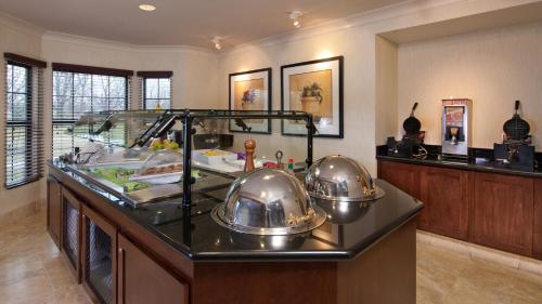 a kitchen with two tea pots on a counter at Staybridge Suites Buffalo by IHG in Buffalo