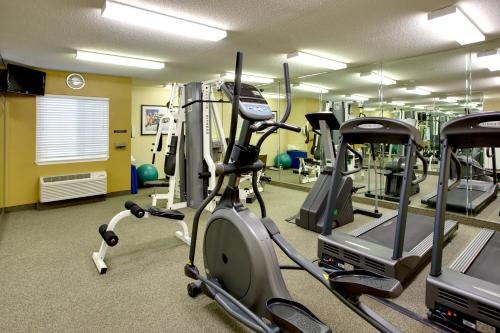 a gym with several tread machines in a room at Candlewood Suites Raleigh Crabtree by IHG in Raleigh
