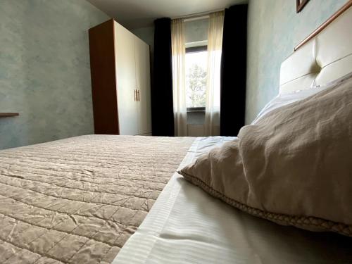 Ein Bett oder Betten in einem Zimmer der Unterkunft Sole della Franciacorta - Hotel & Restaurant
