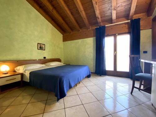 Ein Bett oder Betten in einem Zimmer der Unterkunft Sole della Franciacorta - Hotel & Restaurant