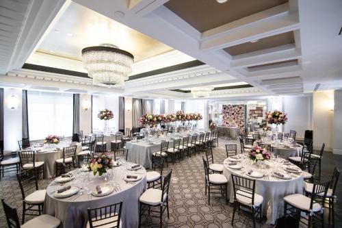 a banquet hall with white tables and chairs at Sofitel Lafayette Square Washington DC in Washington
