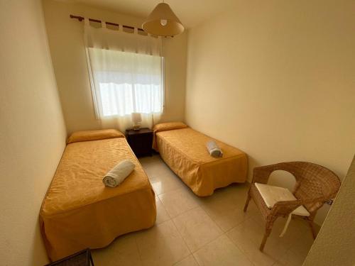 Ένα ή περισσότερα κρεβάτια σε δωμάτιο στο Apartamento en Bahia Golf - Costa Ballena