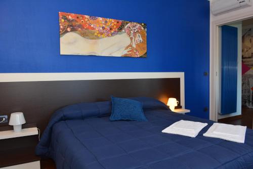 Säng eller sängar i ett rum på Una Casa al Belvedere