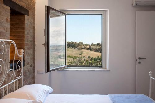Cama o camas de una habitación en Red House Accomodation Potenza Picena
