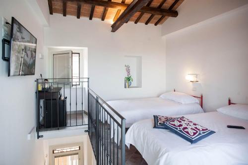 Cama o camas de una habitación en Red House Accomodation Potenza Picena