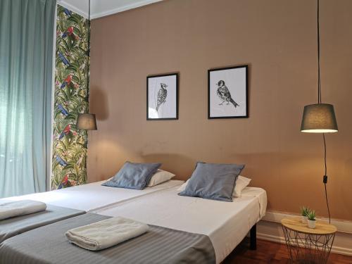 מיטה או מיטות בחדר ב-Castilho 63 Hostel & Suites