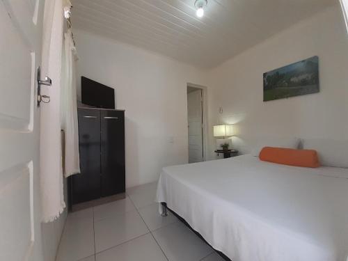 Postel nebo postele na pokoji v ubytování Hotel Pousada Villa Calhau