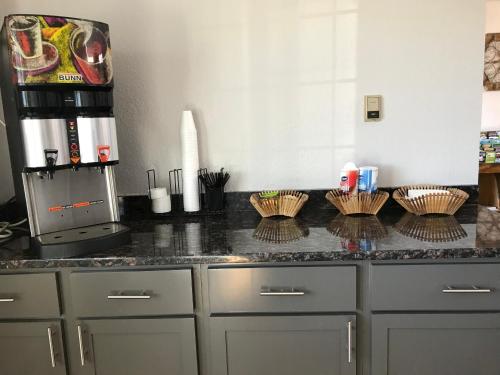 a kitchen with a counter top with baskets on it at HomeTown Inn in Clearwater