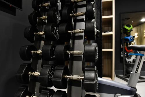 a rack of dumbbells in a gym at Staybridge Suites - Dundee by IHG in Dundee