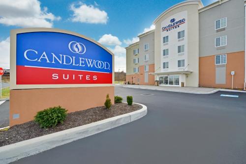 a sign for a hotel in front of a building at Candlewood Suites Harrisburg-Hershey by IHG in Harrisburg