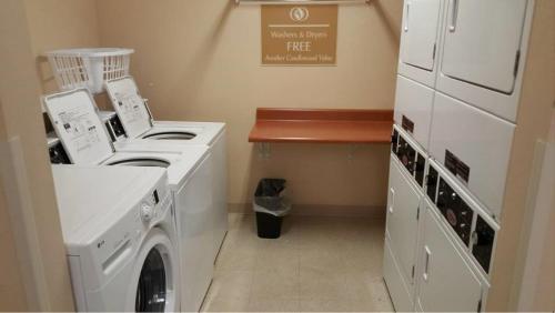 a laundry room with a washer and dryer at Candlewood Suites Hot Springs, an IHG Hotel in Hot Springs
