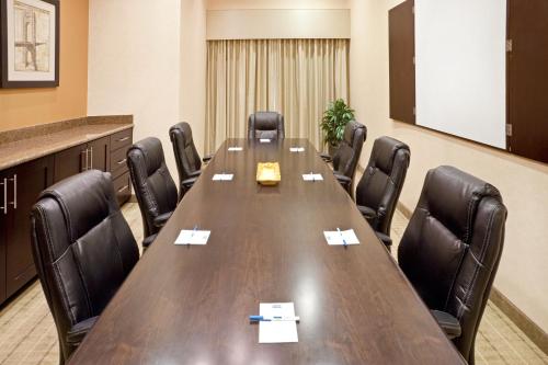 a conference room with a long table and chairs at Staybridge Suites DFW Airport North by IHG in Irving