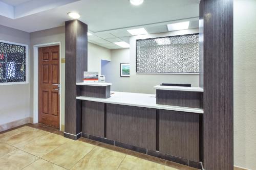 a waiting room at a hospital with a counter at Candlewood Suites Indianapolis Airport, an IHG Hotel in Indianapolis
