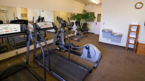 a gym with treadmills and ellipticals in a room at Candlewood Suites Joplin by IHG in Joplin