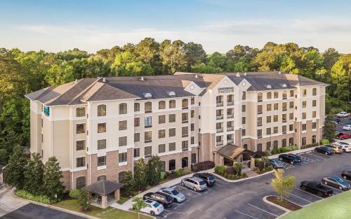 an aerial view of a building with a parking lot at Staybridge Suites North Charleston by IHG in Charleston