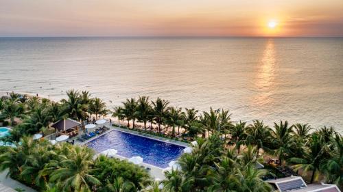 an aerial view of a resort with a pool and the ocean at Amarin Resort & Spa Phu Quoc in Phu Quoc