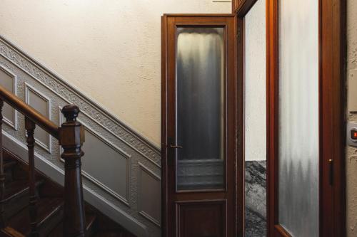 an open door to a room with a stair case at B&B La Passion Interdite in Ostend