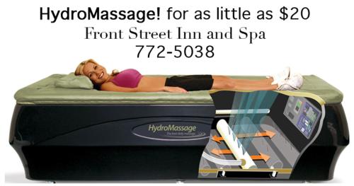 a woman laying on a bed on a scale at Front Street Inn and Spa in Morro Bay