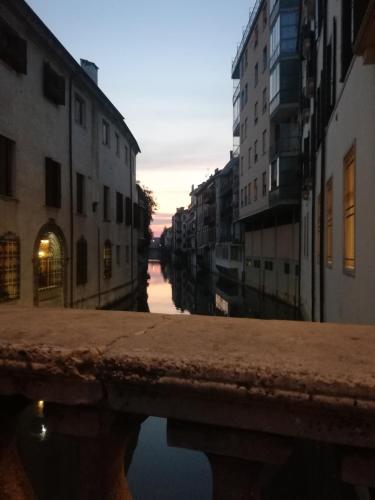 a view of a canal in a city with buildings at Hotel Le Calandre in Rubano