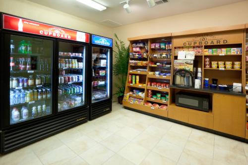 a store with two refrigerators in a grocery store at Candlewood Suites Temple by IHG in Temple