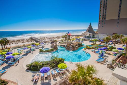 an aerial view of a resort with a pool and beach at Holiday Inn Resort Pensacola Beach Gulf Front by IHG in Pensacola Beach