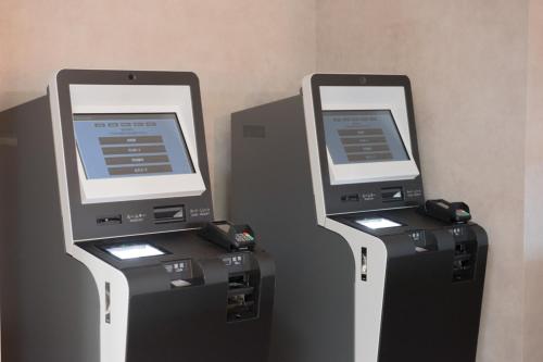 two machines are standing next to each other at The Celecton Matsumoto in Matsumoto