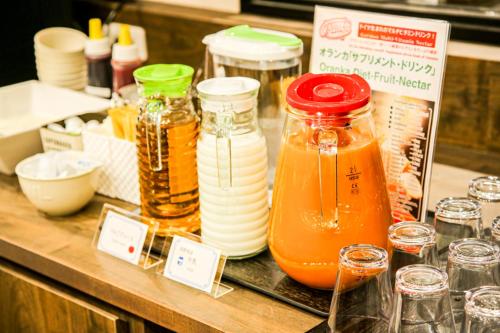 a counter with many jars of honey and other ingredients at The Celecton Matsumoto in Matsumoto