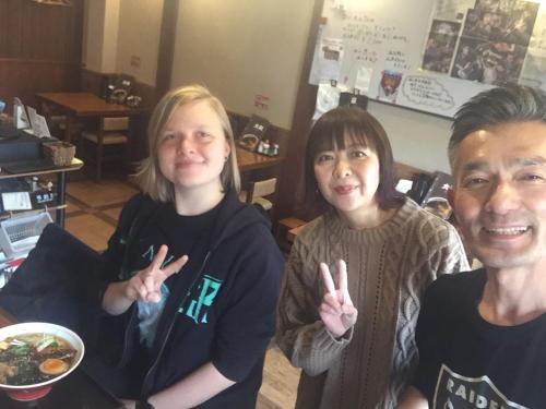 a group of people making the peace sign with their hands at Guest house daisho oshiro asobi in Matsue