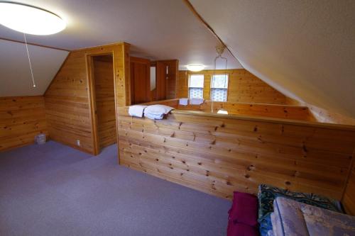 a room with a sauna in a log cabin at Villa Komakusa in Hakuba