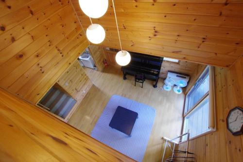 an overhead view of a living room with a piano at Villa Komakusa in Hakuba