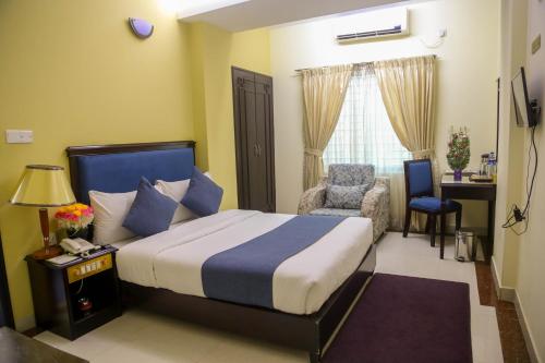 Una cama o camas en una habitación de Hotel Valley Garden - Sylhet