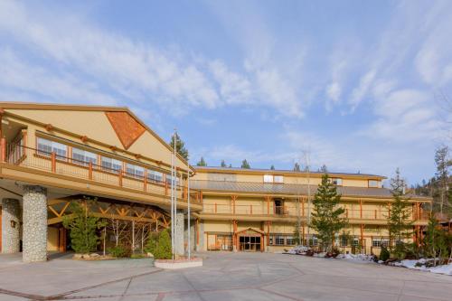 a large building with a clock on the front of it at Holiday Inn Resort The Lodge at Big Bear Lake, an IHG Hotel in Big Bear Lake