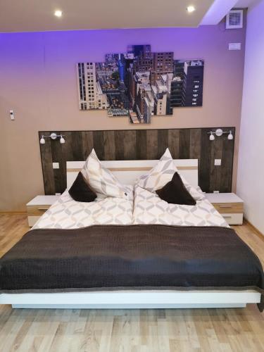 Postel nebo postele na pokoji v ubytování Apartmenthaus Wertheim