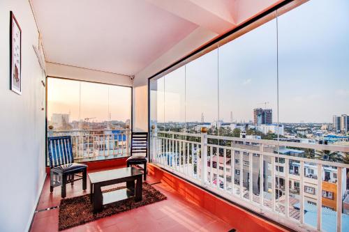 a balcony with a view of a city at FabHotel The Royal Suites - Nr Gopalan innovation mall in Bengaluru