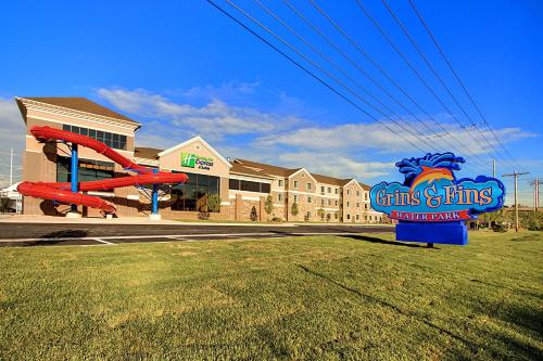 a sign in front of a building with a playground at Staybridge Suites Salt Lake-West Valley City by IHG in West Valley City