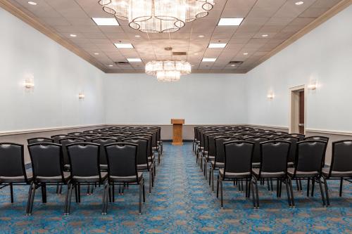 a room with a row of black chairs in it at Holiday Inn Hotel & Suites Oklahoma City North by IHG in Oklahoma City