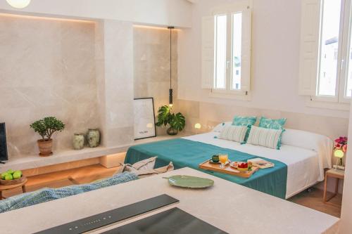 A bed or beds in a room at The Boc Suites