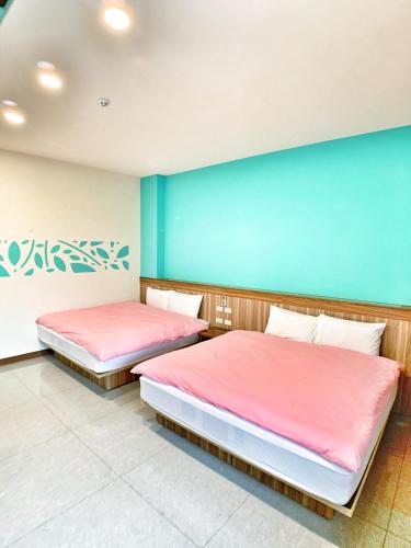 Ένα ή περισσότερα κρεβάτια σε δωμάτιο στο The Sunny Homestay