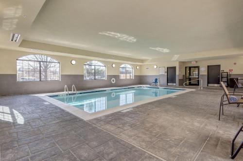 a large swimming pool in a large room at Staybridge Suites St Louis - Westport, an IHG hotel in Maryland Heights