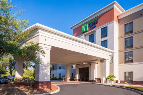 a hotel building with a sign on it at Holiday Inn Express Hotel & Suites Tampa-Anderson Road-Veterans Exp by IHG in Tampa