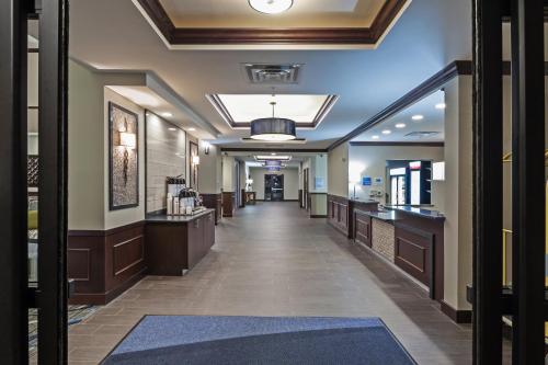 a corridor of a hospital with a hallway at Holiday Inn Express & Suites Glenpool by IHG in Glenpool