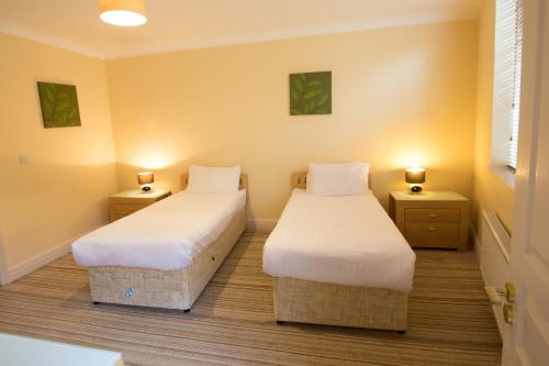 Una cama o camas en una habitación de Ocean Sands Hotel