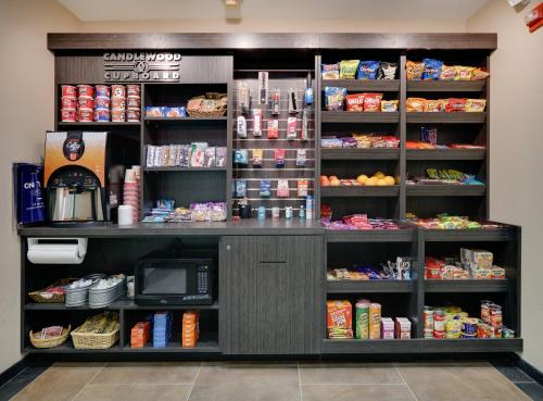 a counter in a store with food and drinks at Candlewood Suites Salina by IHG in Salina