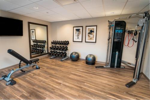 a gym with dumbbells and weights in a room at Staybridge Suites Coeur d'Alene by IHG in Coeur d'Alene