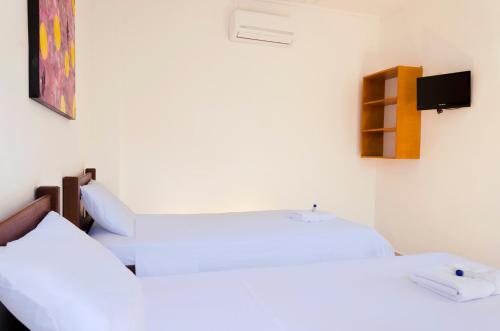 Postel nebo postele na pokoji v ubytování Hotel Ocean Taganga Internacional