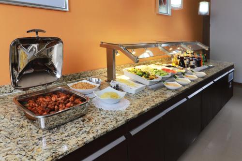 a buffet line with many different types of food at Staybridge Suites Guadalajara Expo by IHG in Guadalajara