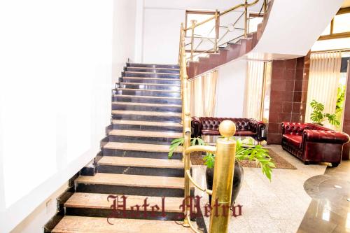 a set of stairs in a building with a stair case at Metro Hotel in Nairobi