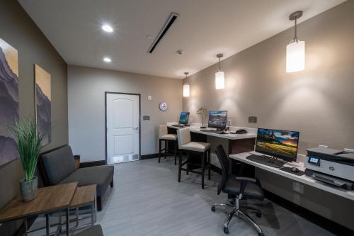 an office with a desk with a computer on it at Staybridge Suites Houston East - Baytown by IHG in Baytown